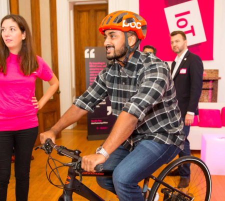 product launch event attendee on t-mobile bicycle